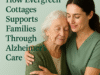 A compassionate caregiver embraces an elderly woman in a calm, supportive setting at Evergreen Cottages, symbolizing Alzheimer’s care and family support.